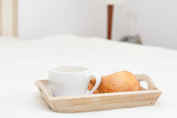 cup of coffee with milk on tray