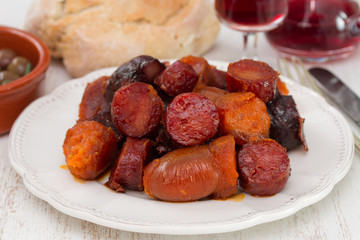 chourico and farinheira on plate and bread with wine