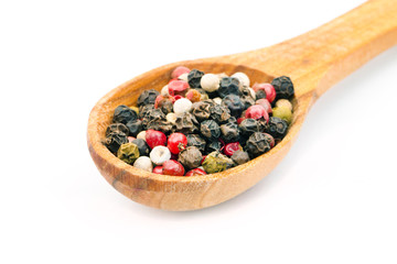 Spice in spoon on white background