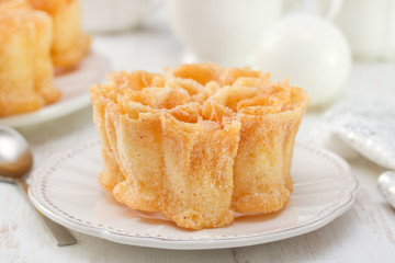 typical portuguese dessert filhos on white plate on white background