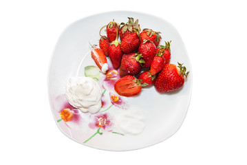 ripe red strawberries on plate isolated on white background
