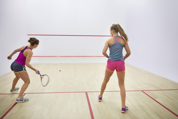 Back view of two squash players