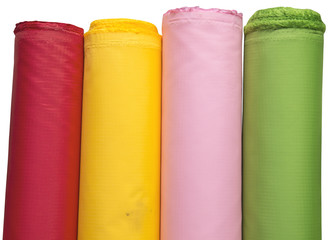 Colorful material fabric rolls on white background
