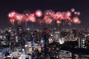 Fireworks celebrating over Tokyo cityscape