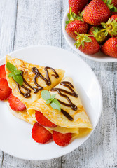 Pancakes with sliced strawberries