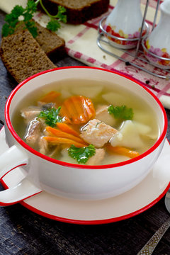 Ear fish soup of red fish salmon in a rustic style