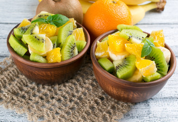 Fototapeta na wymiar Fruit salad with kiwi, banana and orange