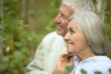 mature couple on  in summer park