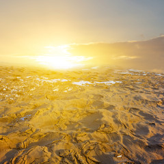 cold winter sand desert at the sunset