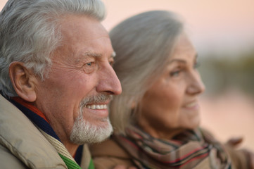 senior couple near river