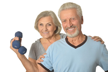 Senior Couple Standing With Dumbbells