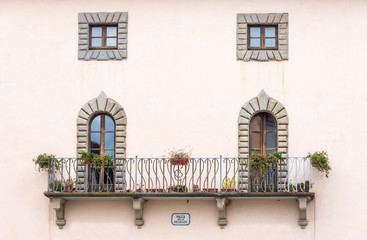Fototapeta na wymiar Architectural symmetry in the square of the Collegiate in Castiglione Fiorentino, a medieval town in Tuscany, Italy