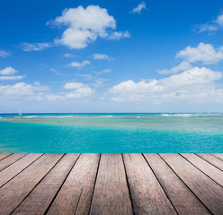 Wood plank with blue sea background