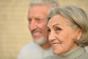 Mature couple near wall