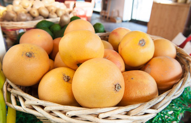 Pink grapefruit heap in market shelf