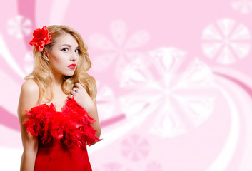 Obraz na płótnie Canvas Pretty girl in red dress on blurred digital pink background