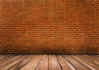 Wood floor with red brick wall