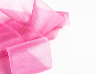 Pink fabric material on a white background