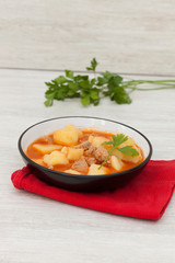 Delicious dish of cooked potatoes with meat