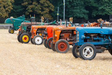 Detail of old tractors in perspective, agricultural vehicle, rural life