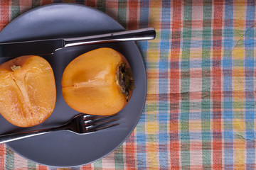 Japanese apple – persimmon on gray plate