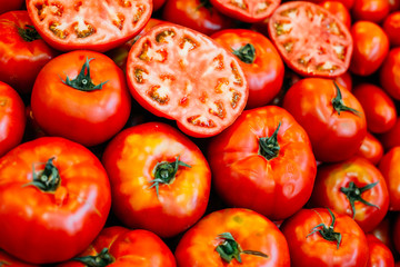 Fresh ripe red  tomatoes forming background