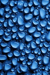 A background with drops of water on a metallic blue surface.