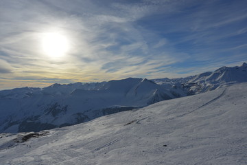 Naklejka na ściany i meble Top of ski slope at nice sun morning. Caucasus Mountains, Georgia, region Gudauri.
