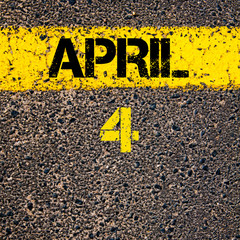 4 April calendar day over road marking yellow paint line