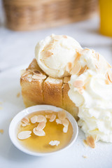 toast with whipping cream, ice cream and honey