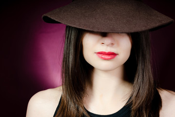 Woman with red lips in hat