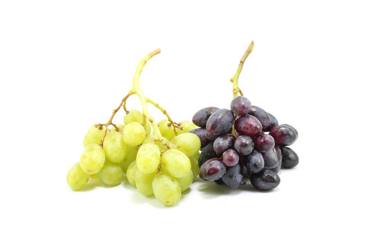 Green and black grapes bunch on white background