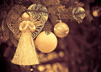 Christmas angel and holiday decoration on Christmas tree.