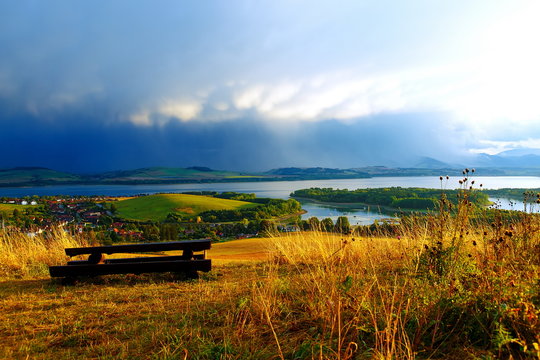 Beautiful landscape, lake with village. Seating overlooking on landscape.
