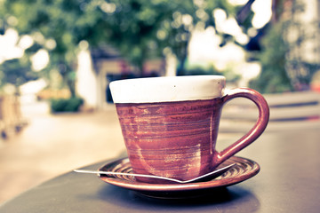Coffee cup in coffee shop - vintage style