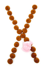 Ginger nuts, pepernoten, in the shape of letter X isolated on wh