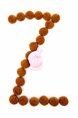 Ginger nuts, pepernoten, in the shape of letter Z isolated on wh