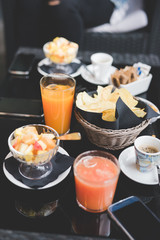 Close up on a bar table with drinks and snacks - happy hour conc