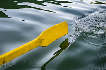Yellow oar above water