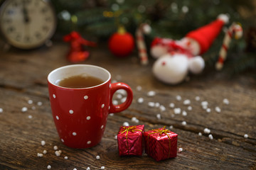 Tea cup with christmas decoration on wooden table