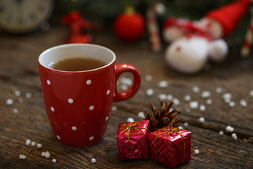 Tea cup with christmas decoration on wooden table