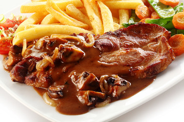Close up of iberian pork loin steak with french fries
