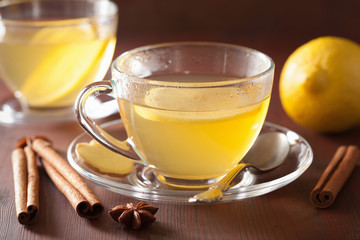 hot lemon ginger cinnamon tea in glass cup