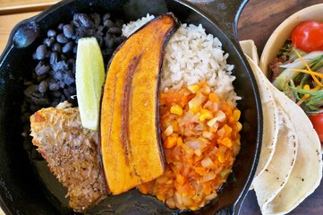 Traditional Costa Rican Casado meal with rice, beans and plantains - obrazy, fototapety, plakaty