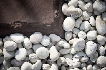 Fototapeta na wymiar White pebbles and granite stone.