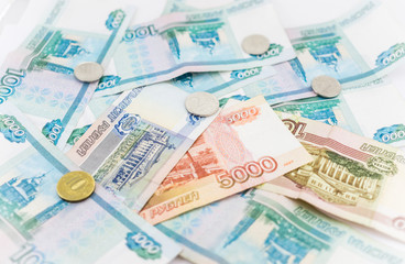 Russian money background. Ruble banknotes and coins of different denominations