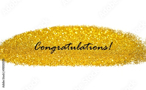 word congratulation on blurry background of golden glitter sparkles
