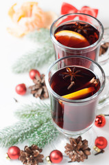 Hot mulled wine with cinnamon, star anise and orange slice