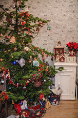 Fototapeta na wymiar Decorated Christmas tree on blurred