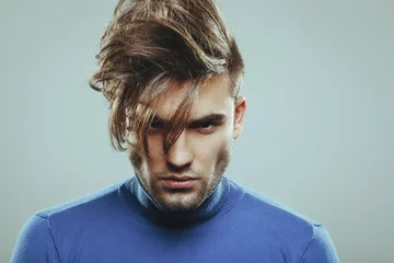 Foto auf Acrylglas Friseur Handsome man with modern hairstyle in studio